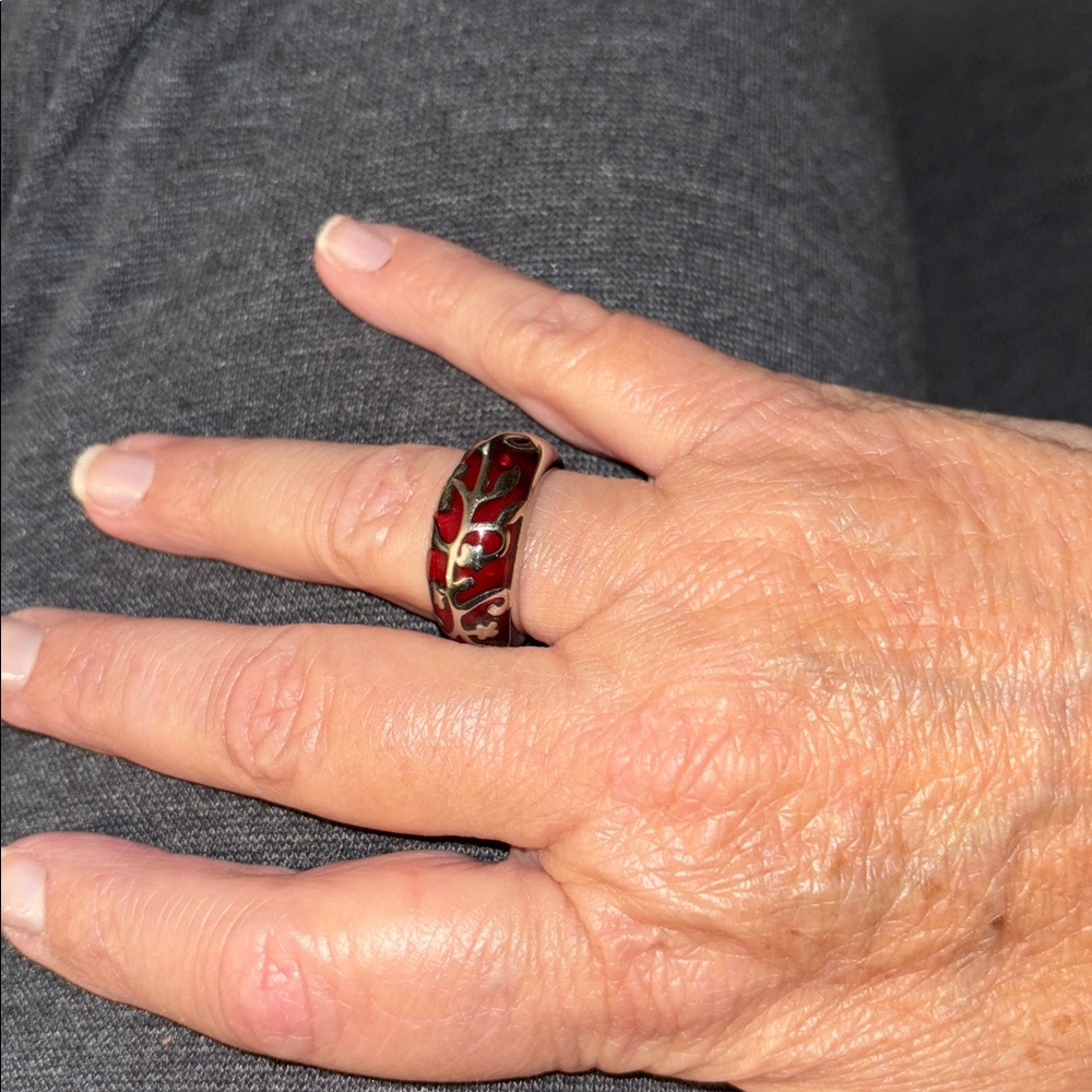 Pink stone with silver filigree design
